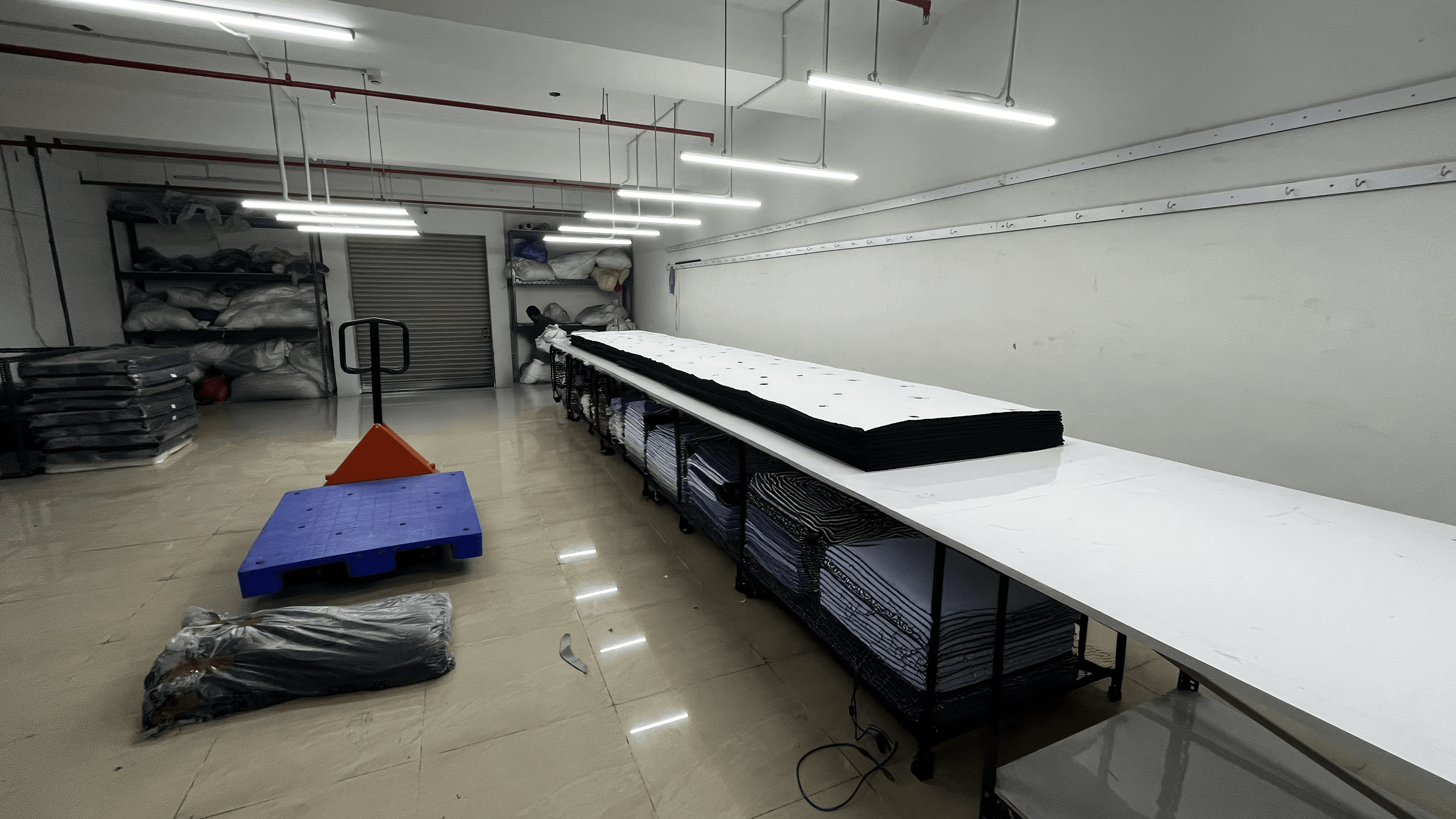 Dedicated space for precision fabric cutting and rigorous quality checks, where every piece is inspected for consistency before entering production. Plakads Cutting and Fabric Quality Checking Space