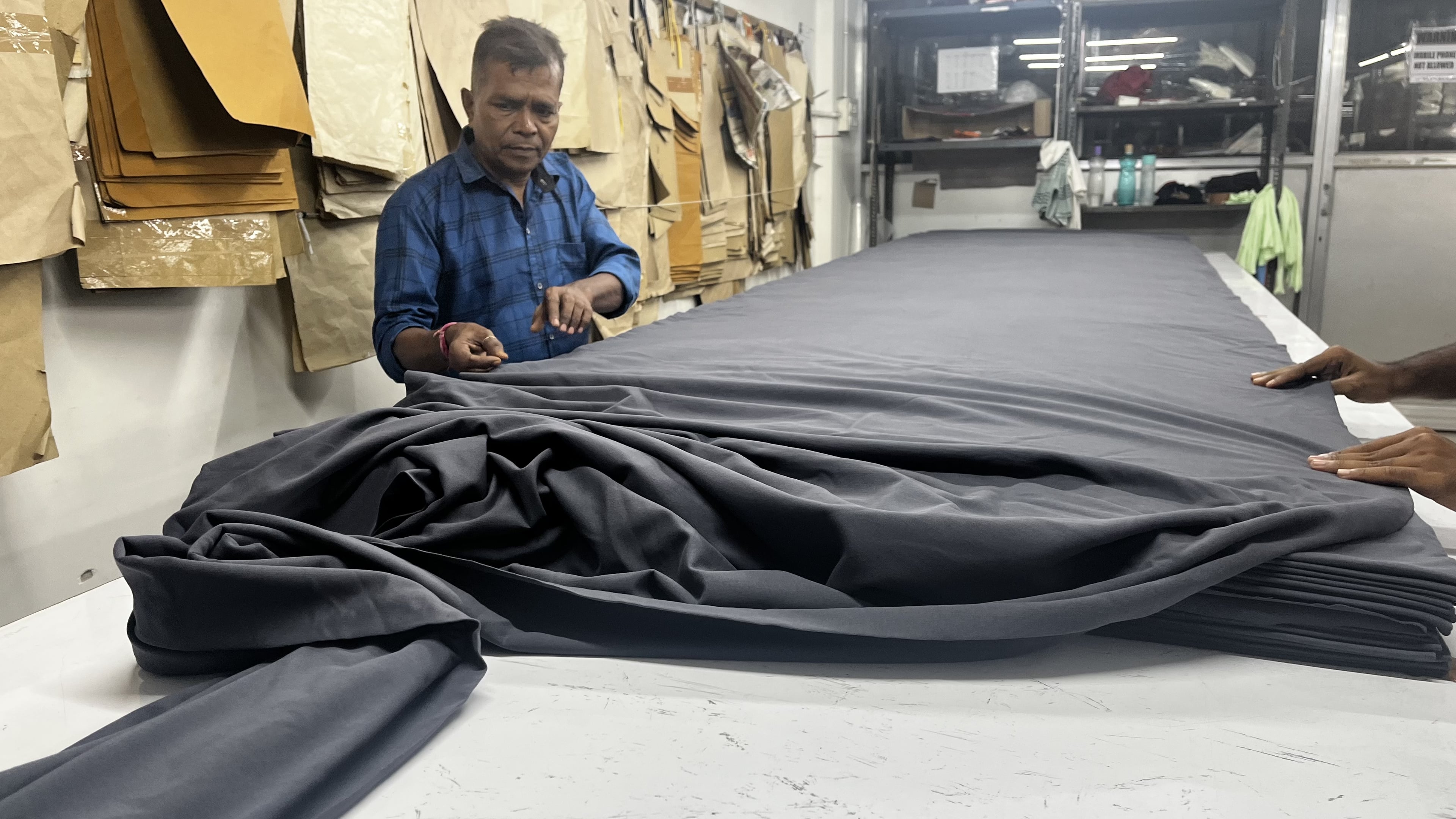 Modern cutting facility in action, utilizing advanced techniques to minimize fabric waste and ensure pattern accuracy across all garments. Plakads Cutting Space During Active Production