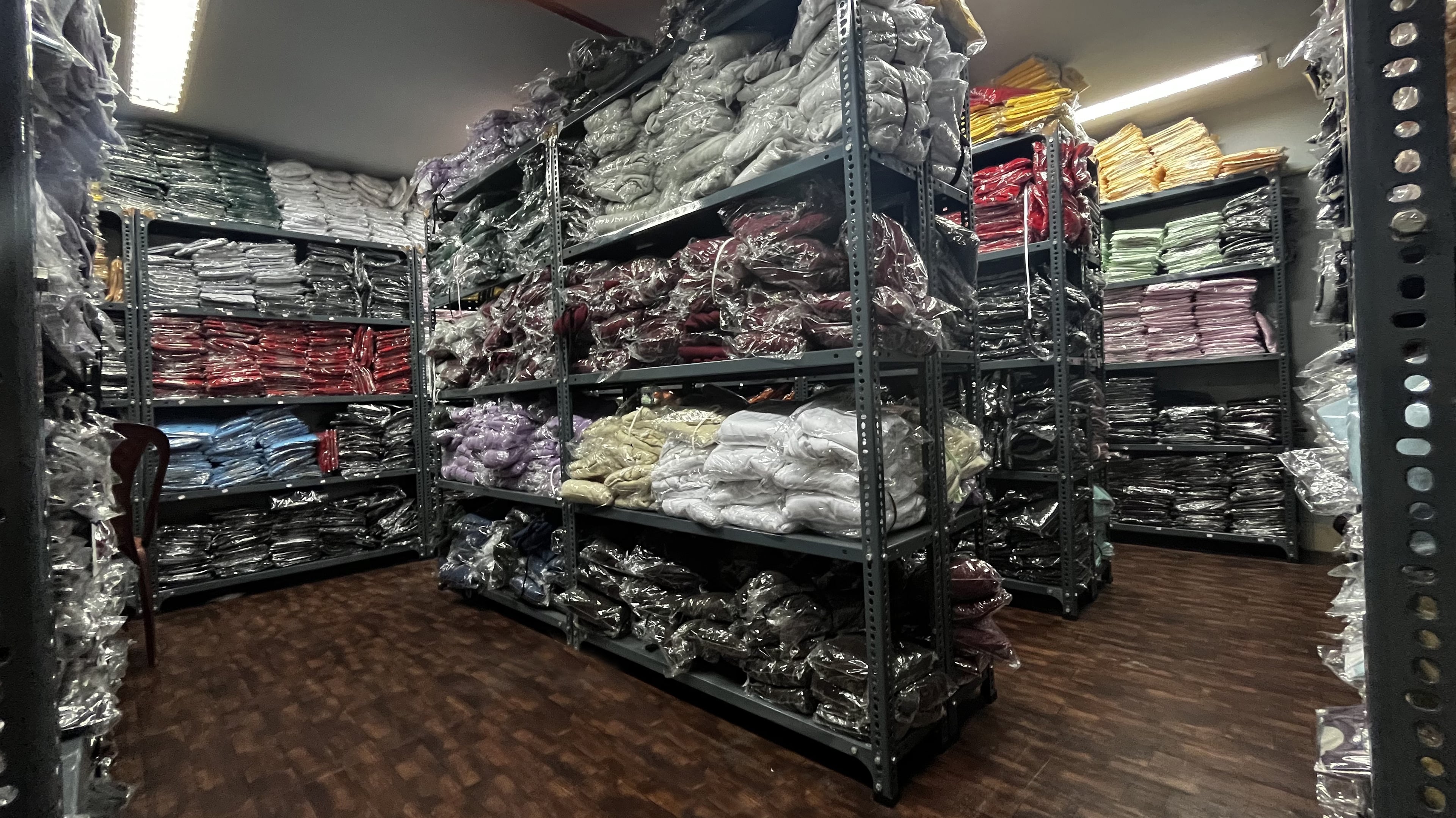 Organized storage area for office supplies, samples, and merchandise, maintaining efficient inventory management across our operations. Plakads Office Goods Storage and Inventory Management Room