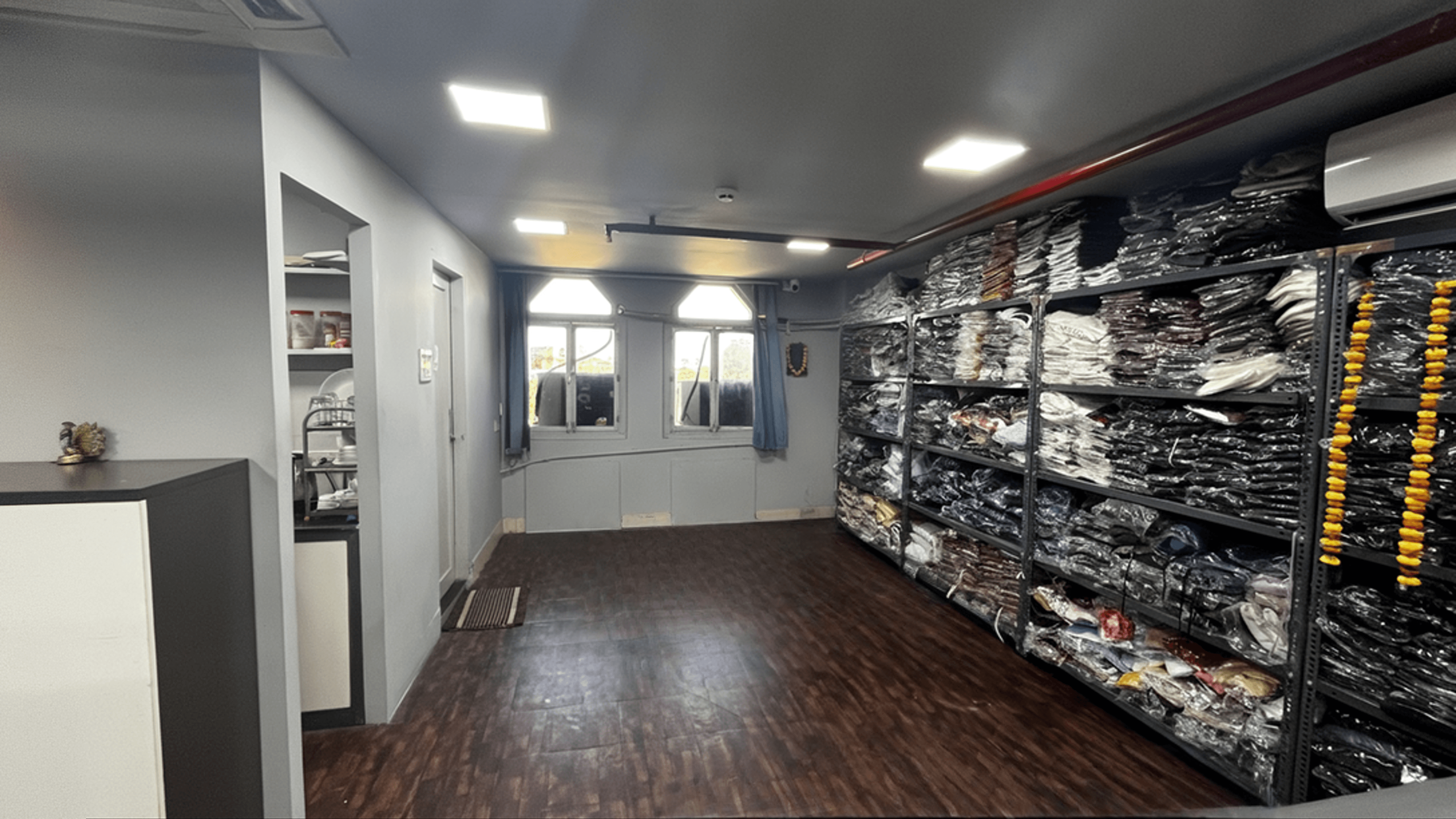 Organized packing and inventory management area where finished garments are carefully packed and prepared for dispatch to our clients. Plakads Packing and Assorted Stock Management Area